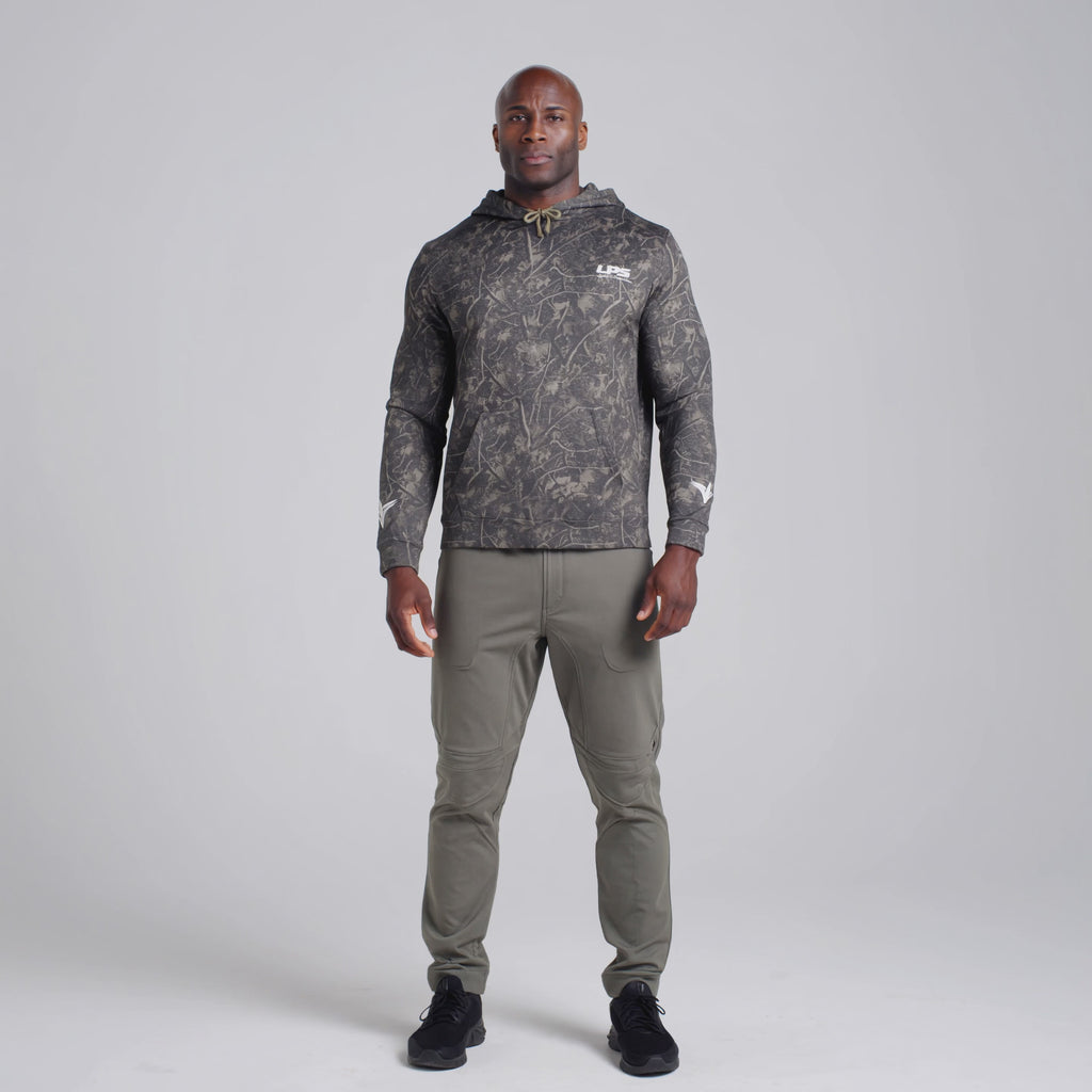 LPS Man wearing unisex camo heavyweight hoodie