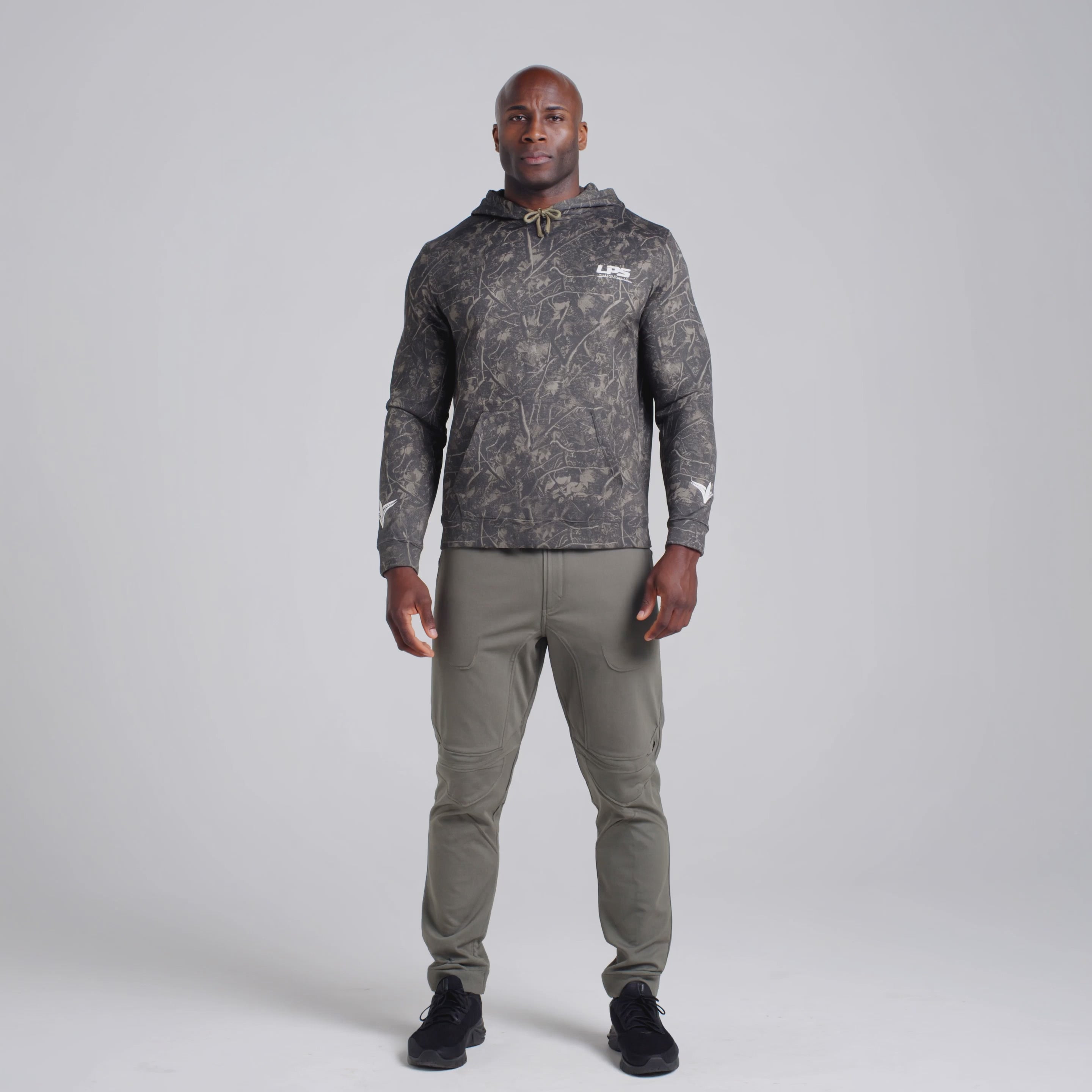 LPS Man wearing unisex camo heavyweight hoodie